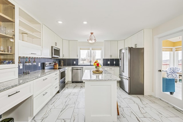 kitchen with recessed lighting, a sink, marble finish floor, and appliances with stainless steel finishes