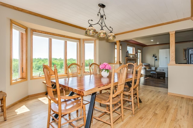 dining room featuring baseboards, ornamental molding, wood ceiling, and light wood-style flooring