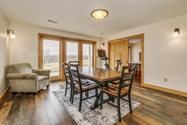 dining area with baseboards, french doors, dark wood-type flooring, and visible vents