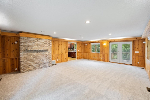 7872 142nd St W, Apple Valley, MN 55124 - unfurnished living room featuring wooden walls, carpet flooring, and recessed lighting