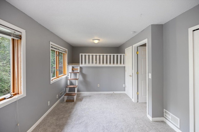 7872 142nd St W, Apple Valley, MN 55124 - unfurnished room featuring carpet flooring, a smoke detector, and a textured ceiling