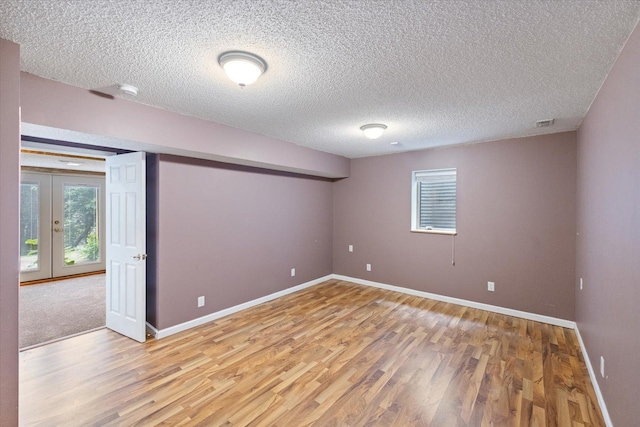 7872 142nd St W, Apple Valley, MN 55124 - spare room featuring light wood-style floors and a textured ceiling