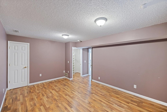 7872 142nd St W, Apple Valley, MN 55124 - unfurnished room featuring light wood finished floors and a textured ceiling