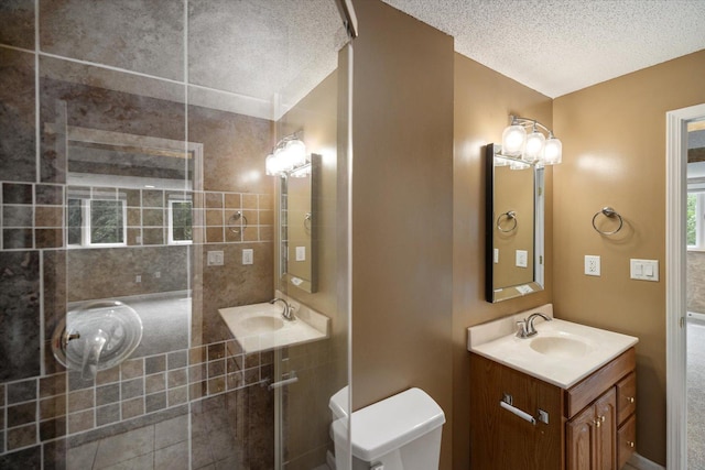 7872 142nd St W, Apple Valley, MN 55124 - full bathroom featuring a textured ceiling, tiled shower, and vanity