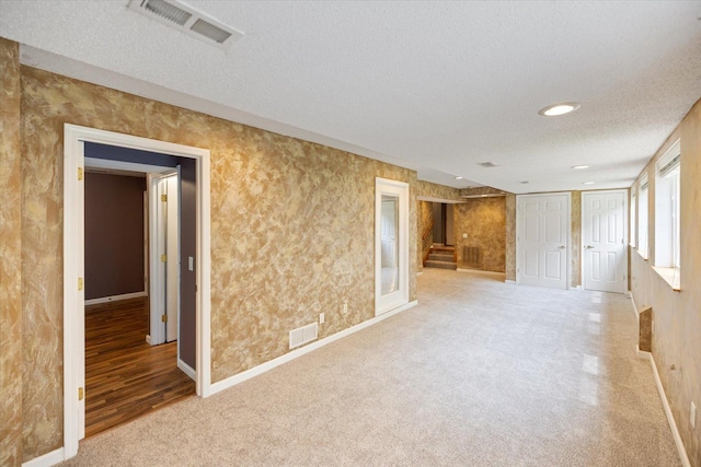 7872 142nd St W, Apple Valley, MN 55124 - empty room featuring a textured ceiling, stairs, and carpet floors