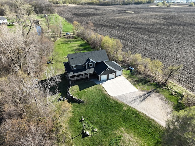 birds eye view of property featuring a rural view