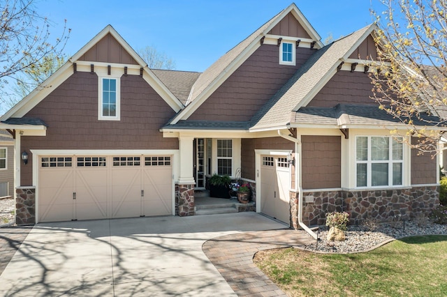 5435 Yellowstone Trl, Minnetrista, MN 55331 - craftsman house featuring stone siding, a shingled roof, and driveway