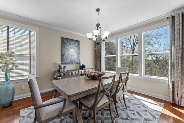 5435 Yellowstone Trl, Minnetrista, MN 55331 - dining area featuring a chandelier, crown molding, healthy amount of natural light, and wood finished floors