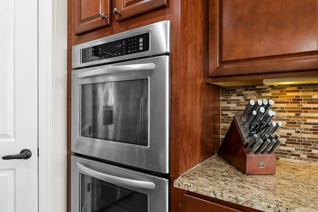 5435 Yellowstone Trl, Minnetrista, MN 55331 - kitchen with backsplash, double oven, and light stone countertops