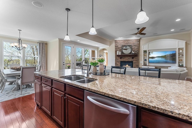 5435 Yellowstone Trl, Minnetrista, MN 55331 - kitchen featuring dishwasher, a sink, ornamental molding, open floor plan, and dark wood-style flooring