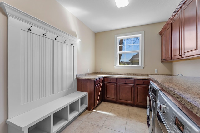 5435 Yellowstone Trl, Minnetrista, MN 55331 - clothes washing area featuring cabinet space, separate washer and dryer, and light tile patterned floors