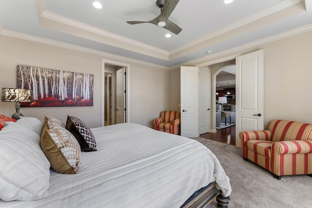 5435 Yellowstone Trl, Minnetrista, MN 55331 - bedroom with a tray ceiling, arched walkways, ornamental molding, recessed lighting, and a ceiling fan