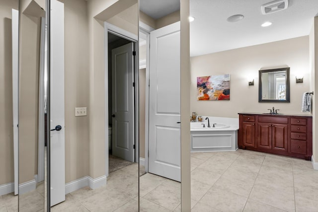 5435 Yellowstone Trl, Minnetrista, MN 55331 - full bathroom featuring a bath, vanity, tile patterned floors, and baseboards