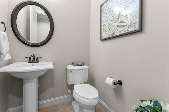 5435 Yellowstone Trl, Minnetrista, MN 55331 - half bath featuring baseboards, toilet, and a sink