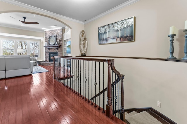 5435 Yellowstone Trl, Minnetrista, MN 55331 - corridor featuring arched walkways, hardwood / wood-style flooring, ornamental molding, and baseboards