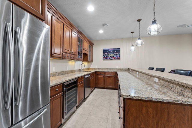 5435 Yellowstone Trl, Minnetrista, MN 55331 - kitchen featuring appliances with stainless steel finishes, beverage cooler, glass insert cabinets, a peninsula, and light stone counters