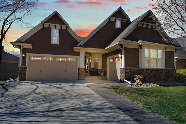 5435 Yellowstone Trl, Minnetrista, MN 55331 - craftsman house featuring stone siding, concrete driveway, and a garage