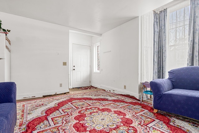 living area featuring baseboards