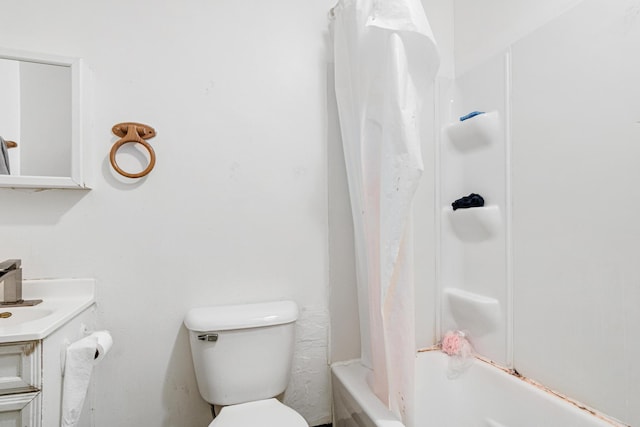 bathroom featuring vanity, shower / bath combo, and toilet