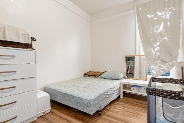 bedroom featuring wood finished floors