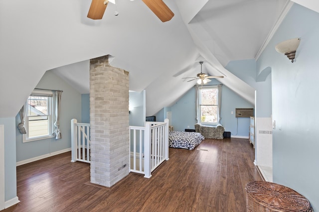 additional living space featuring baseboards, ceiling fan, wood finished floors, and lofted ceiling