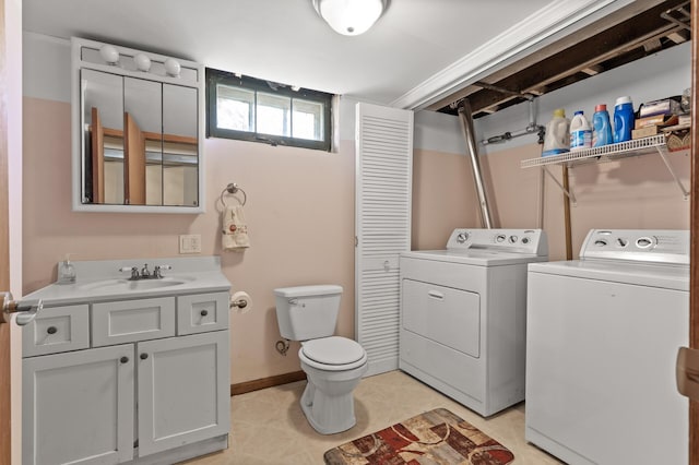 laundry room with washer and dryer, laundry area, and a sink