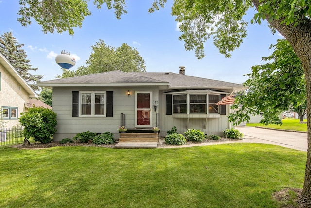 517 2nd St, Waconia, MN 55387 - view of front of property with a shingled roof and a chimney