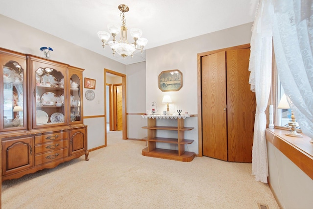 517 2nd St, Waconia, MN 55387 - corridor with a chandelier and light colored carpet