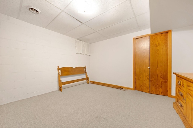 517 2nd St, Waconia, MN 55387 - finished basement with a drop ceiling, light carpet, and concrete block wall