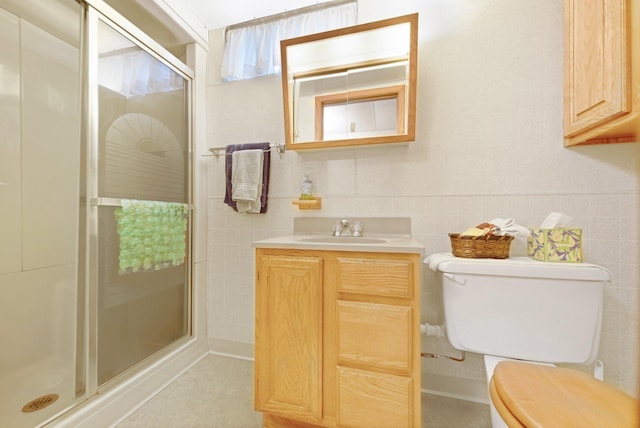 517 2nd St, Waconia, MN 55387 - bathroom featuring a shower stall, vanity, and tile walls