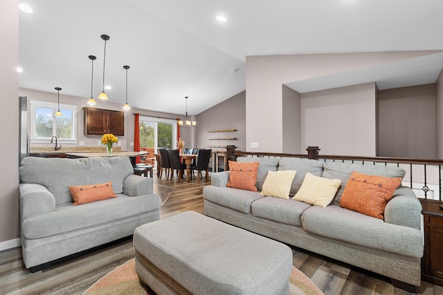 1226 1st St, Saint Paul Park, MN 55071 - living room featuring light wood-style floors, recessed lighting, a chandelier, and lofted ceiling