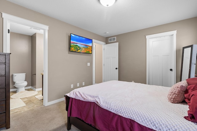 1226 1st St, Saint Paul Park, MN 55071 - bedroom featuring carpet flooring, baseboards, visible vents, and ensuite bath