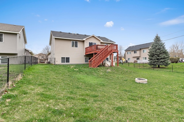 1226 1st St, Saint Paul Park, MN 55071 - back of house featuring a deck, a fenced backyard, stairs, an outdoor fire pit, and a yard