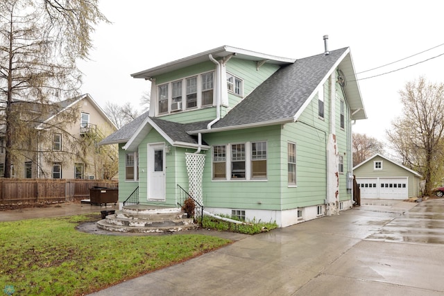 803 10th Ave N, Fargo, ND 58102 - bungalow-style home with a detached garage, fence, an outdoor structure, and a shingled roof