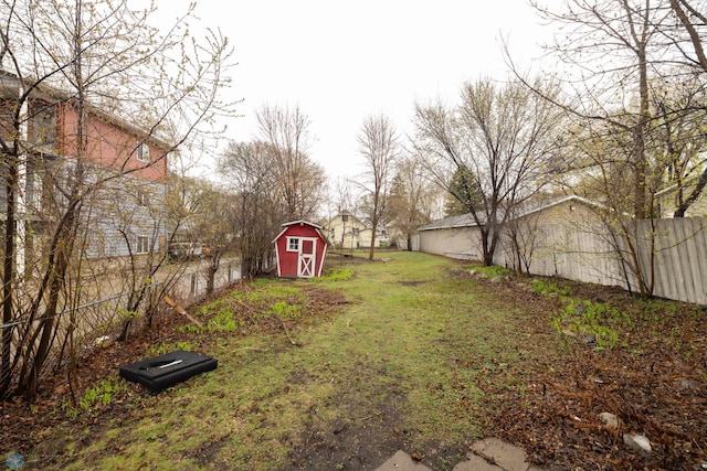 803 10th Ave N, Fargo, ND 58102 - view of yard with an outdoor structure, a shed, and fence