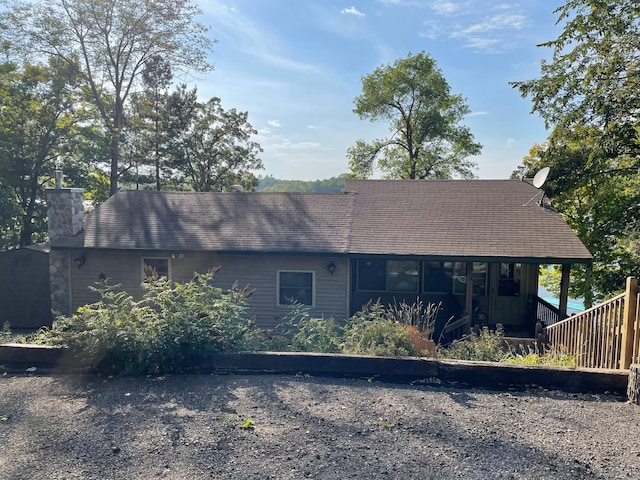 single story home featuring a chimney