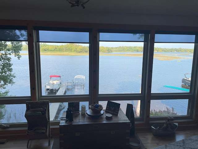 interior space with a water view and a wealth of natural light