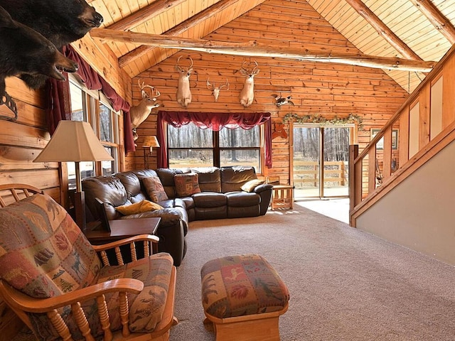 20703 Aspen Dr, Grand Rapids, MN 55744 - carpeted living room with wood ceiling, beam ceiling, stairway, high vaulted ceiling, and wooden walls