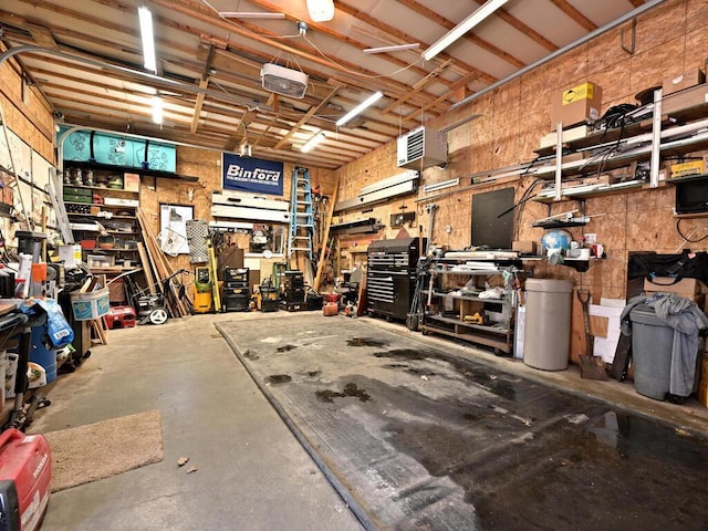 20703 Aspen Dr, Grand Rapids, MN 55744 - garage with a workshop area and a garage door opener