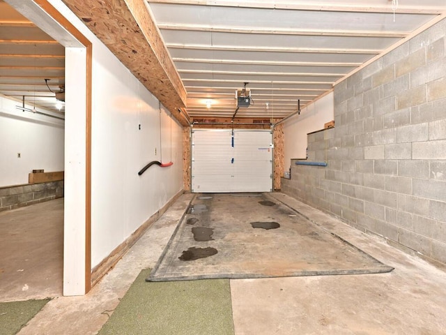20703 Aspen Dr, Grand Rapids, MN 55744 - garage with a garage door opener and concrete block wall