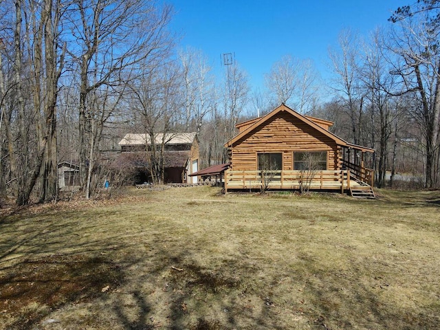 20703 Aspen Dr, Grand Rapids, MN 55744 - exterior space with a wooden deck, log exterior, and a yard