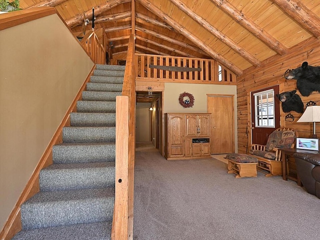 20703 Aspen Dr, Grand Rapids, MN 55744 - carpeted living room featuring a wooden ceiling with exposed beams, stairs, high vaulted ceiling, and wood walls