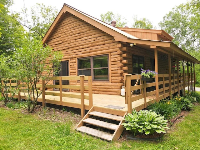 20703 Aspen Dr, Grand Rapids, MN 55744 - view of home's exterior with log siding and a deck