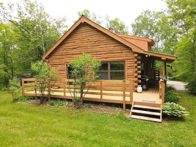 20703 Aspen Dr, Grand Rapids, MN 55744 - rear view of house featuring log exterior, a yard, and a wooden deck