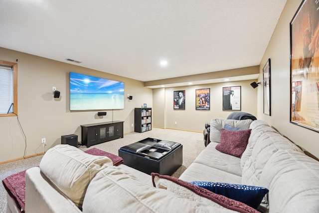 carpeted living room with visible vents, recessed lighting, and baseboards