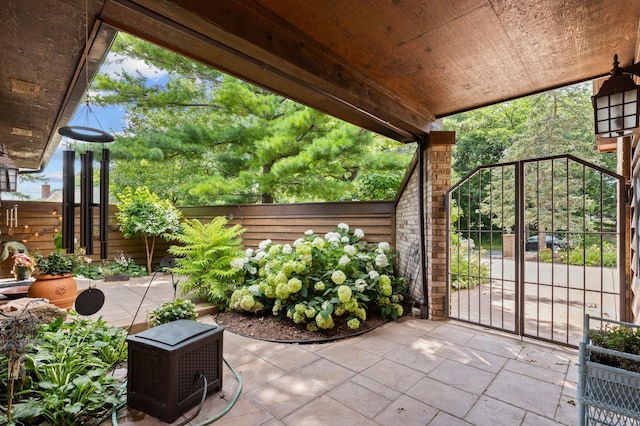 view of patio featuring fence