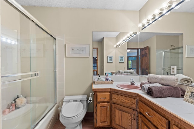 bathroom featuring toilet, vanity, enclosed tub / shower combo, and tile patterned floors
