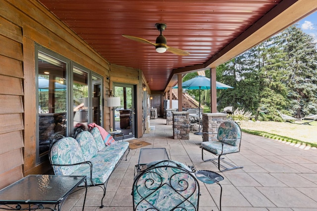 view of patio / terrace with stairs and ceiling fan