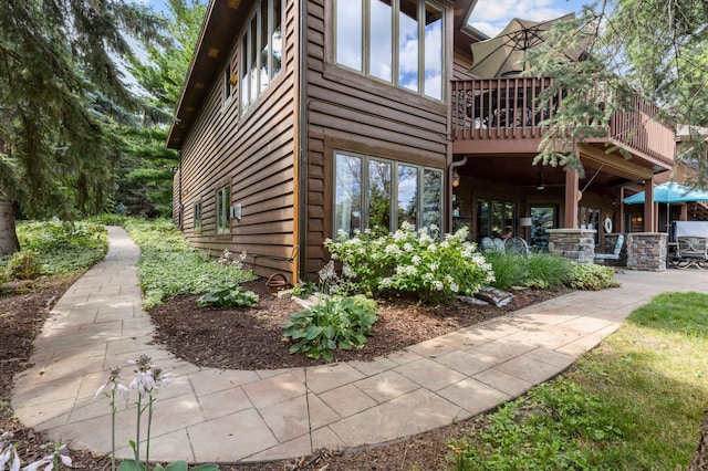 view of property exterior with a balcony