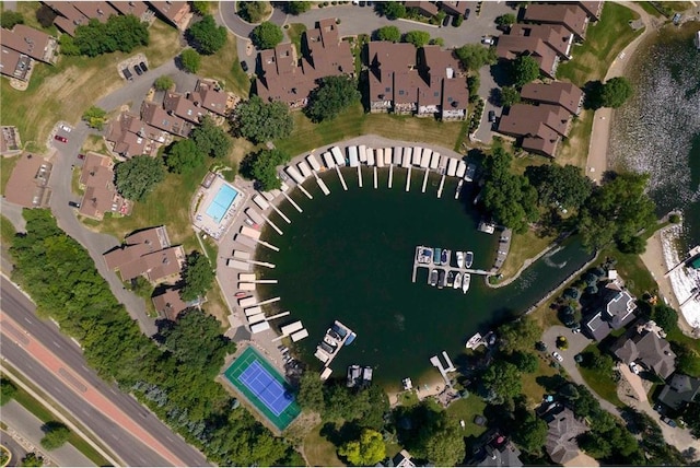 aerial overview of property's location featuring a nearby body of water and nearby suburban area